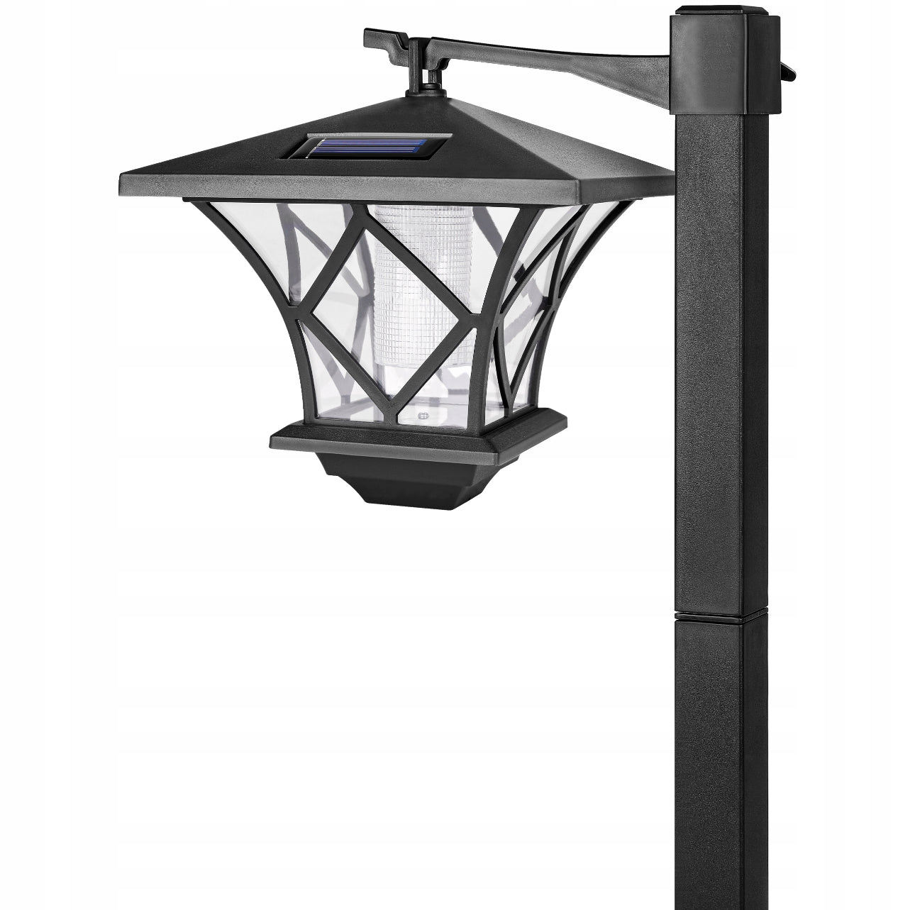 Nærbilde av svart solcellelampe til hage med klart glass og diamantmønster.
