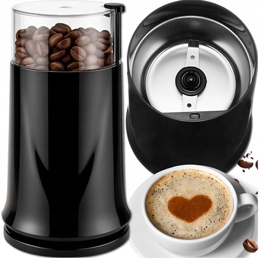 Elektrisk kaffekvern i sort plast med gjennomsiktig lokk, fylt med kaffebønner