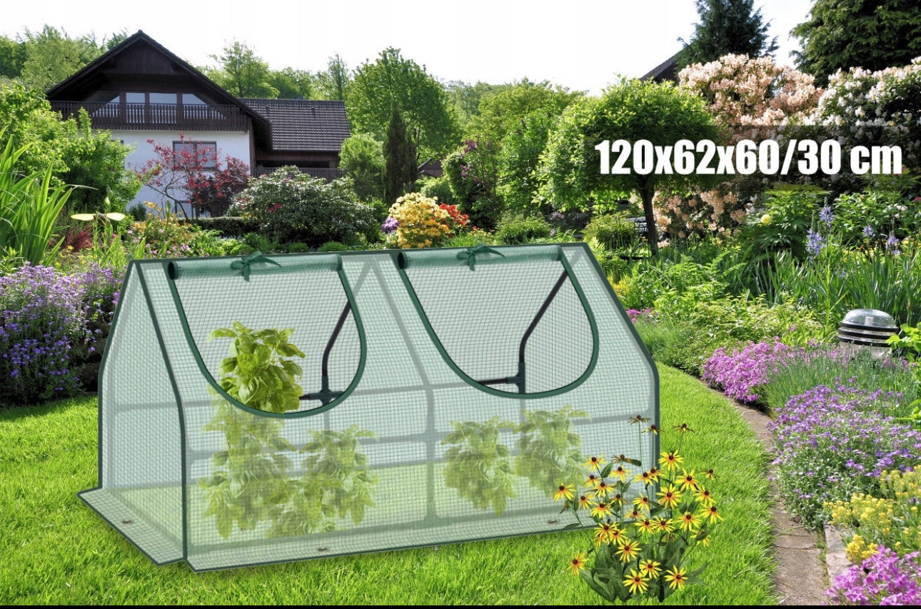 Grønt drivhus med to glidelåsåpninger i blomstrende hage, målt til 120x62x60/30 cm
