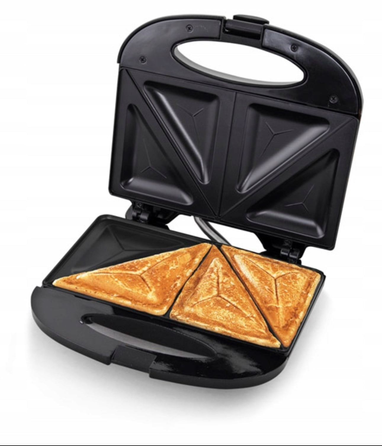 Svart toastjern med ferdigstekte, sprø sandwicher på varmeplater.