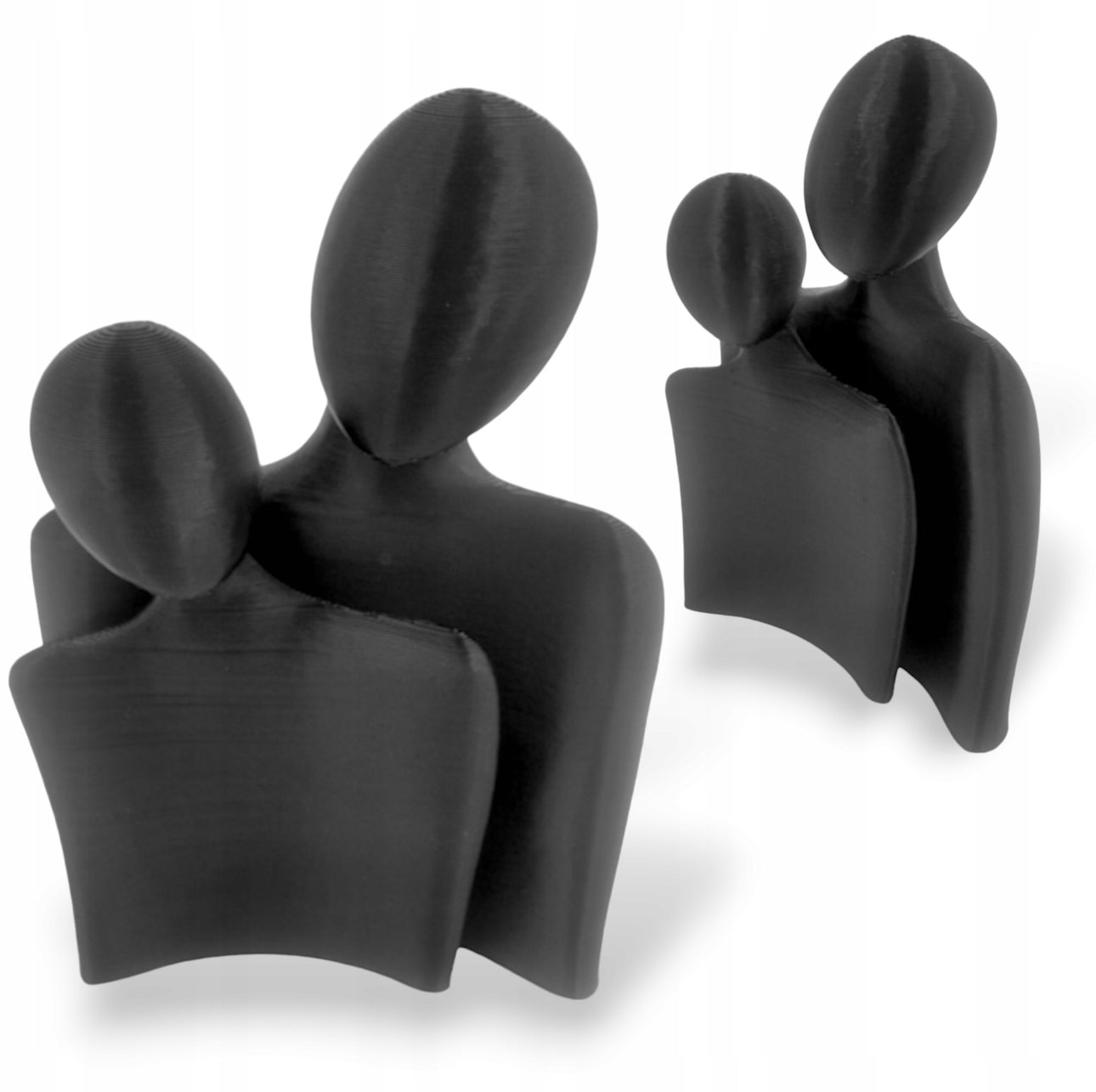 Moderne skulptur av kjærlighetspar, 15 cm høy og 11 cm bred, i sort bio-materiale. Perfekt som minimalistisk dekorasjon til hjemmet.