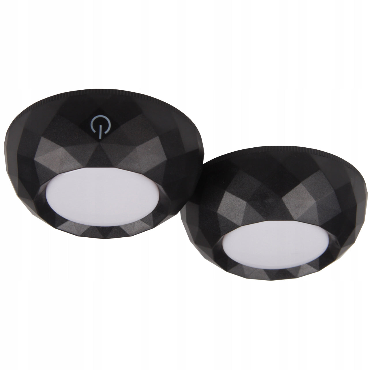 To svarte, runde LED nattlamper med fasettdesign og hvitt lysfelt